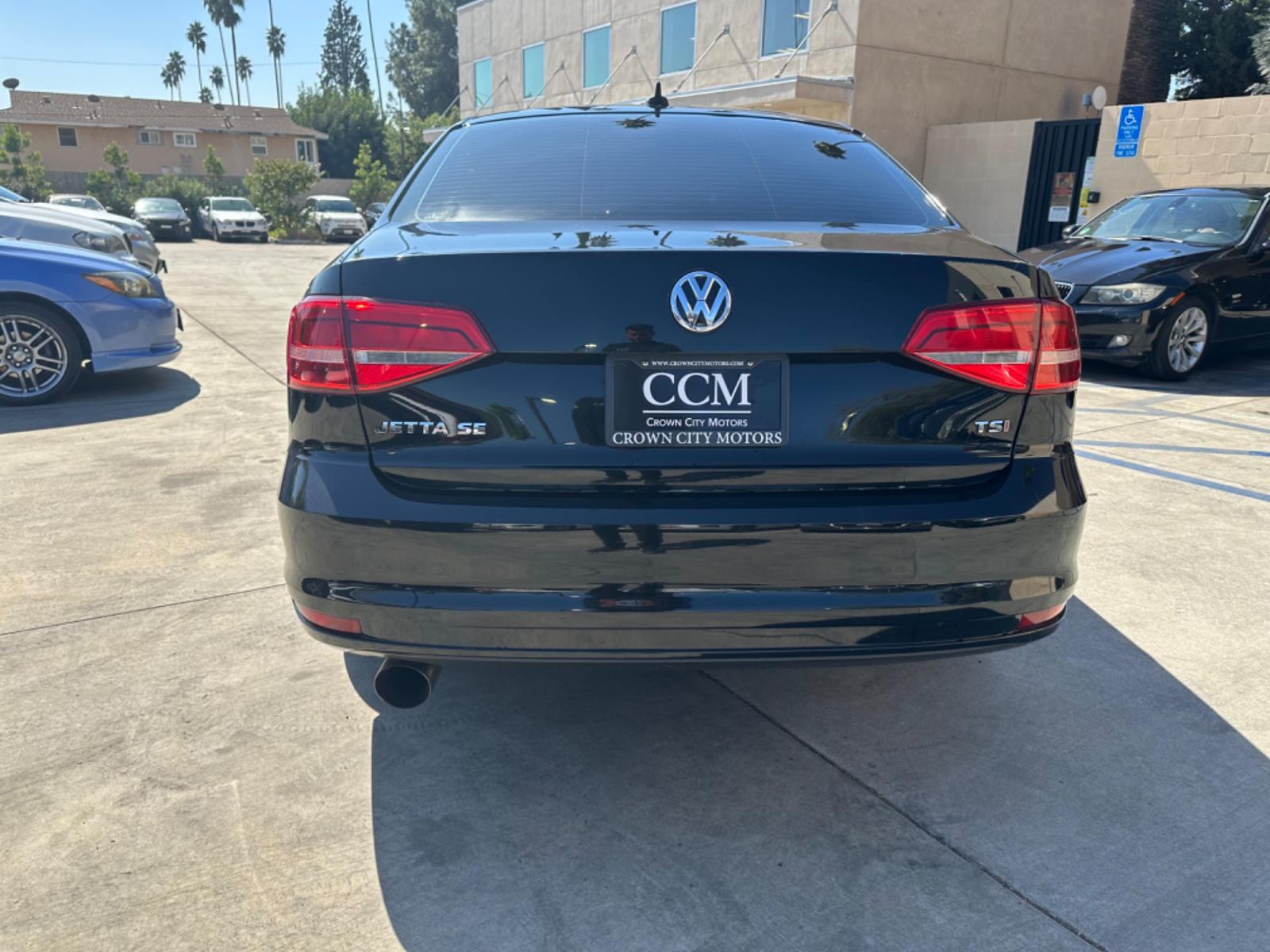 2015 Black /Black Volkswagen Jetta SE 5M (3VWD17AJ4FM) with an 1.8L L4 DOHC 20V engine, Automatic transmission, located at 30 S. Berkeley Avenue, Pasadena, CA, 91107, (626) 248-7567, 34.145447, -118.109398 - Black on Black! Premium Wheels! The 2015 Volkswagen Jetta SE encapsulates the ideal blend of contemporary design, advanced features, and the reliable performance Volkswagen is renowned for. Its sleek contours and sophisticated aesthetics reflect urban sensibilities, making it perfect for city drive - Photo #3